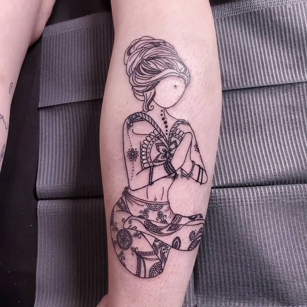 Intricate female figure in meditative pose tattoo