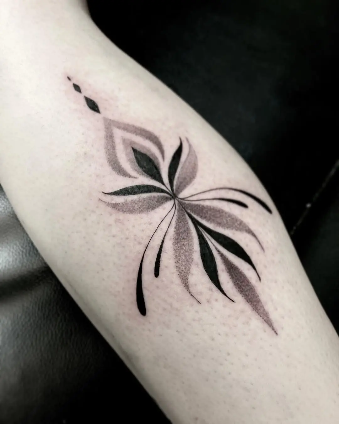 Elegant floral yoga-inspired tattoo design