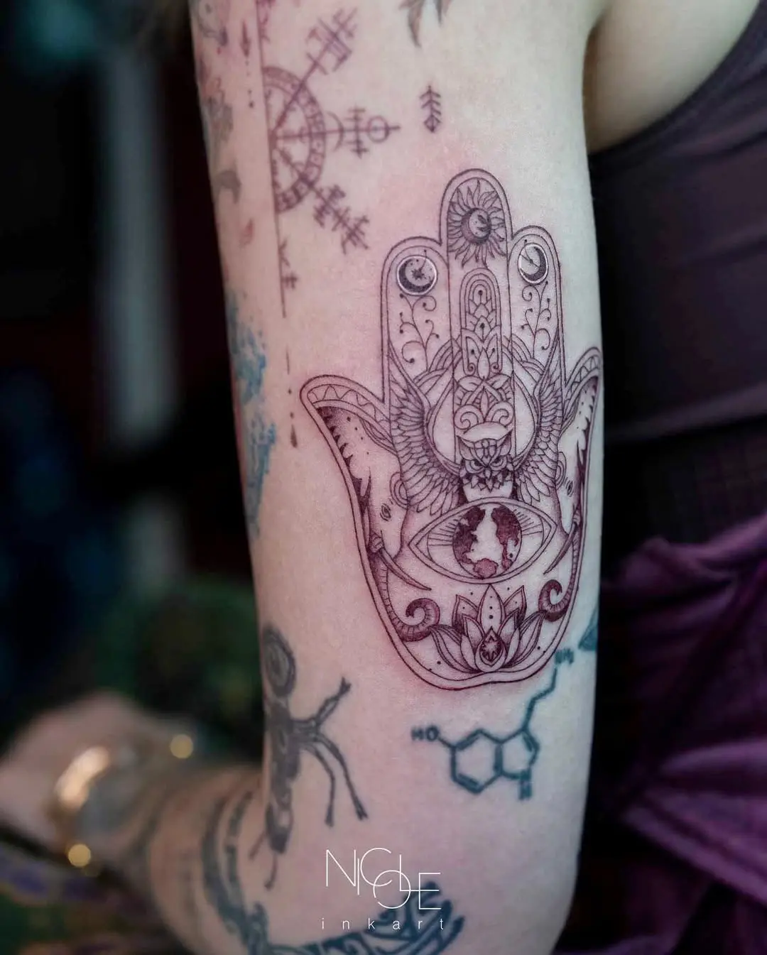 Intricate hand tattoo with eye symbolism