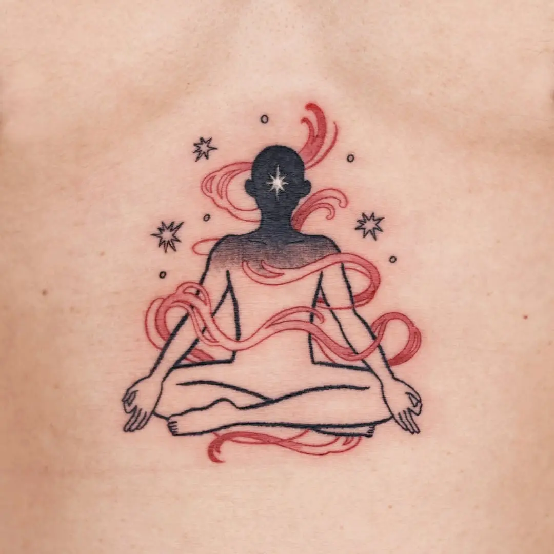 Serene meditation tattoo with cosmic elements