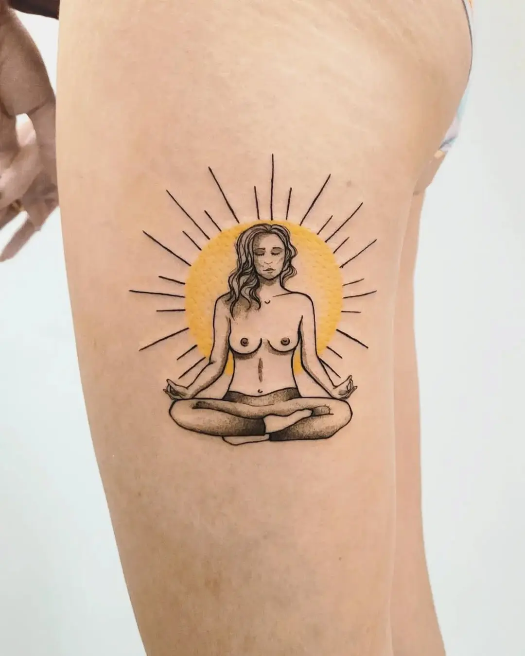 Meditative woman tattoo with sun rays