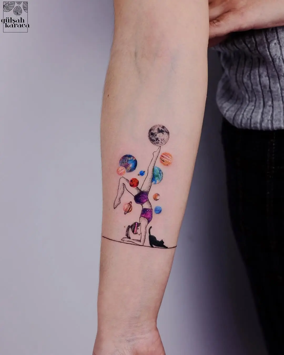 Cosmic yoga tattoo with vibrant planetary elements