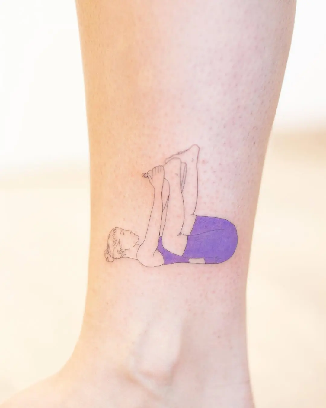 Artistic depiction of a yoga pose tattoo