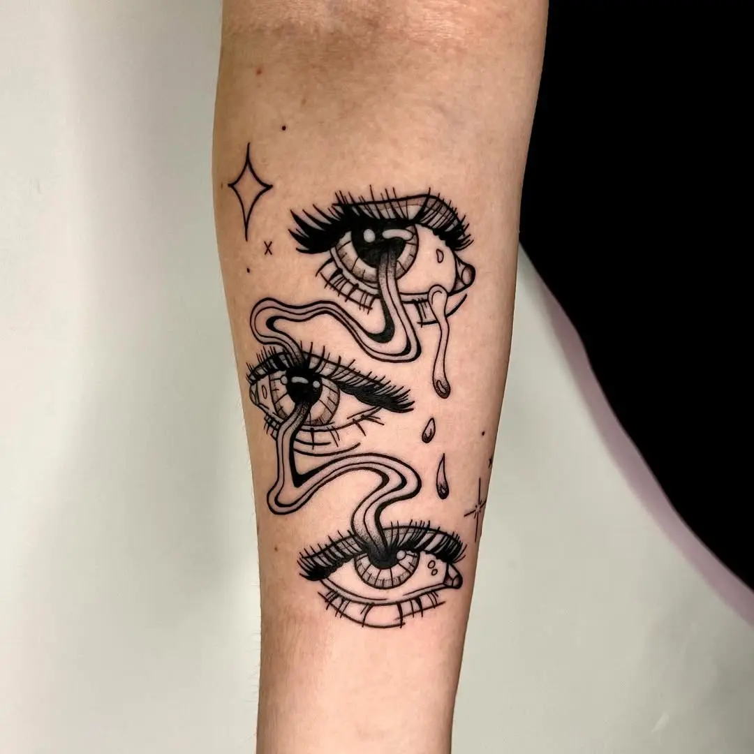 Unique, artistic eye tattoo design with drips
