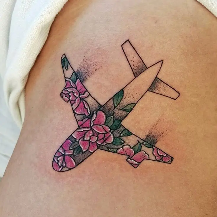 Floral airplane tattoo with vibrant colors.