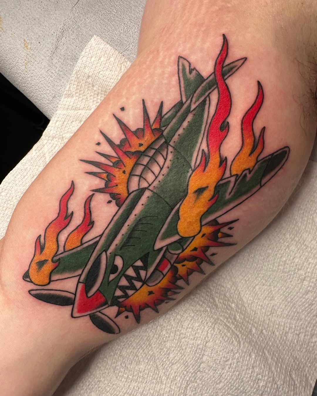 Dynamic airplane tattoo with explosive elements