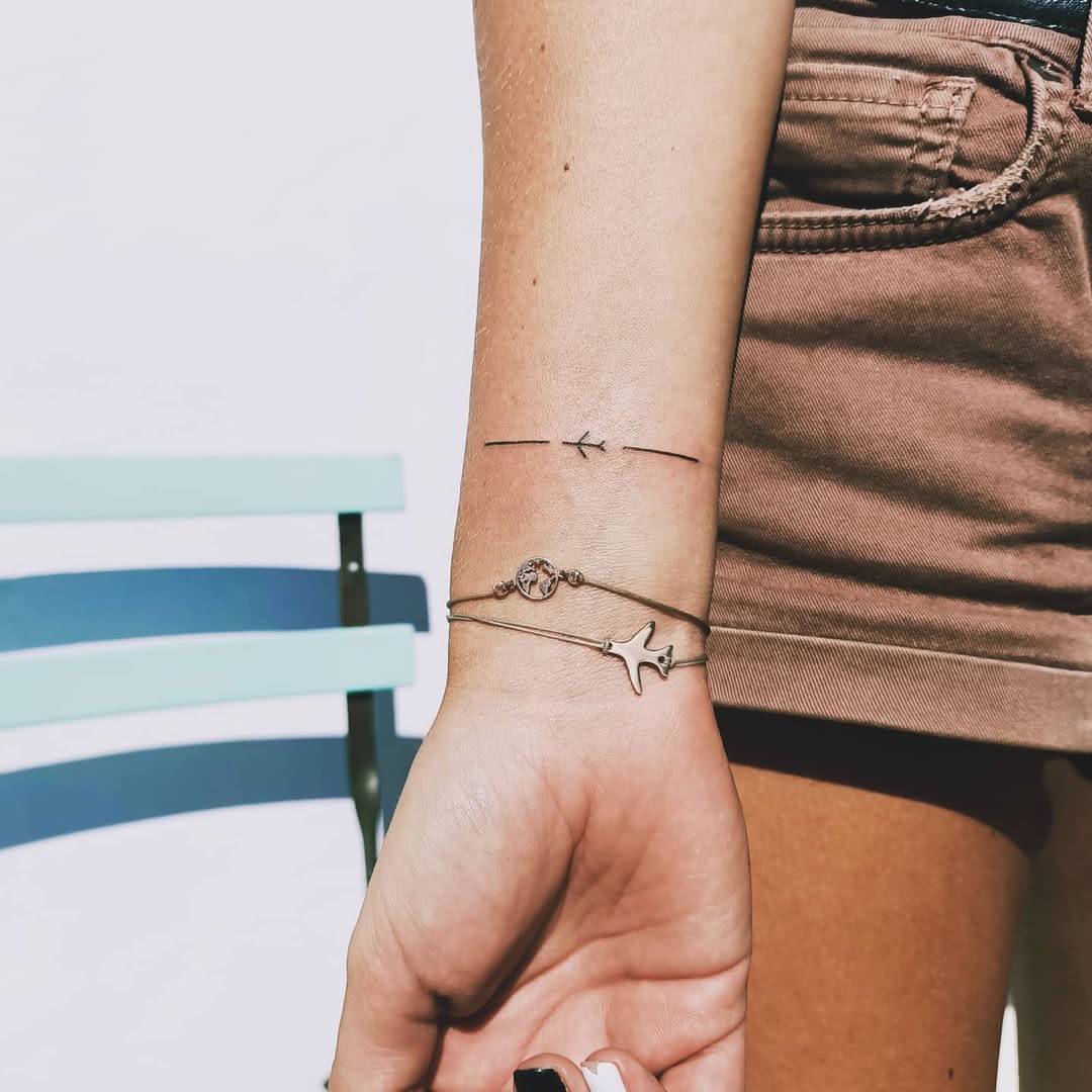 Minimalist Airplane Tattoo with Simple Lines