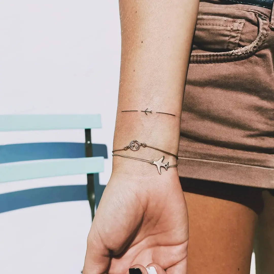 Minimalist Airplane Tattoo with Simple Lines