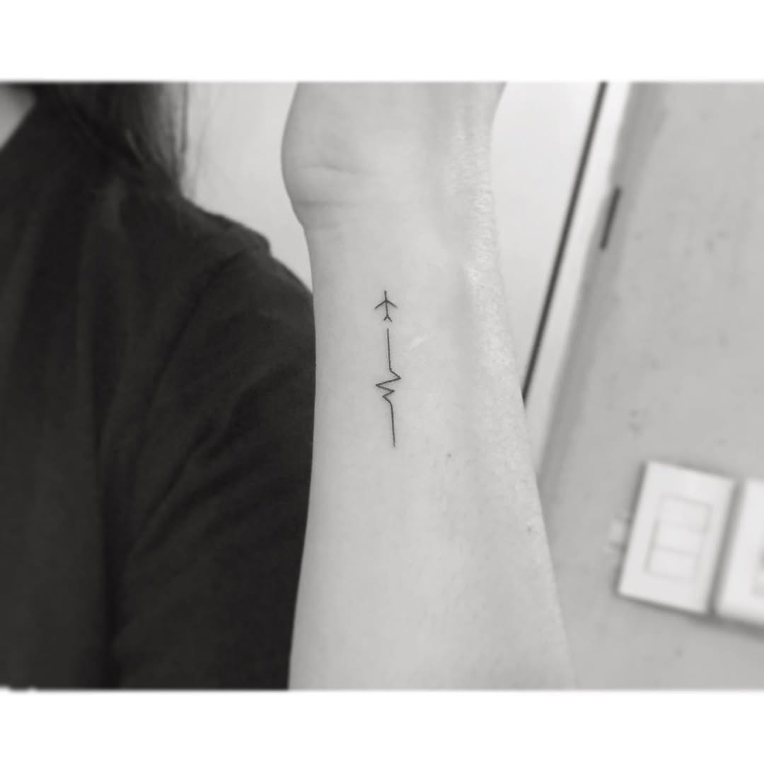 Stylish minimalistic airplane tattoo design