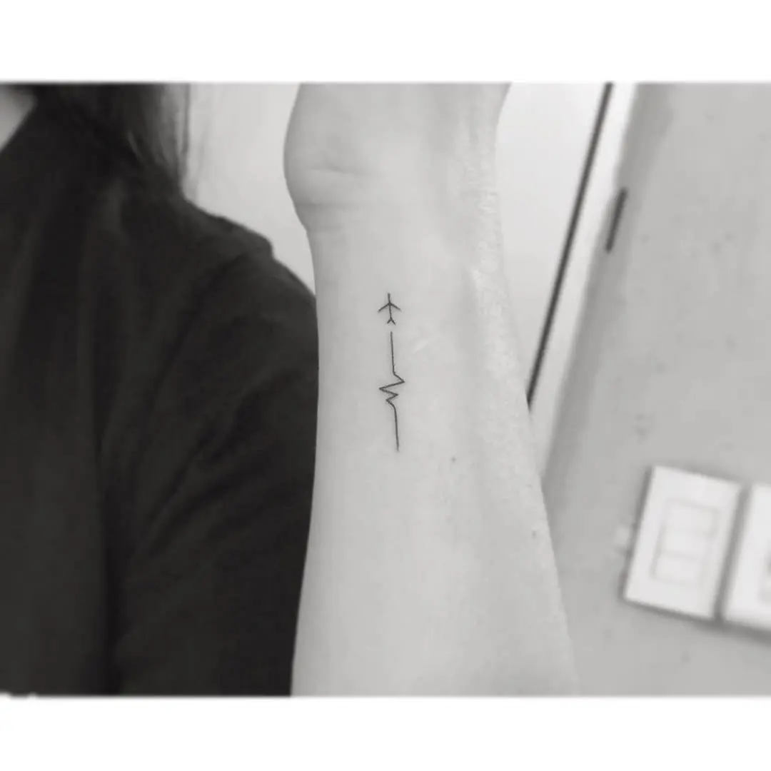 Stylish minimalistic airplane tattoo design