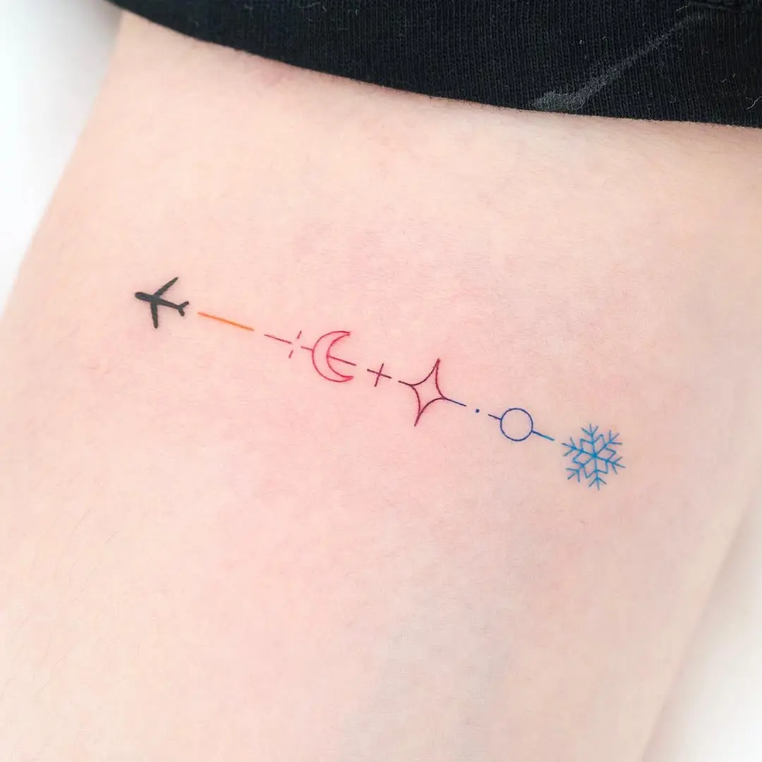 Minimalist Airplane Tattoo with Celestial Elements