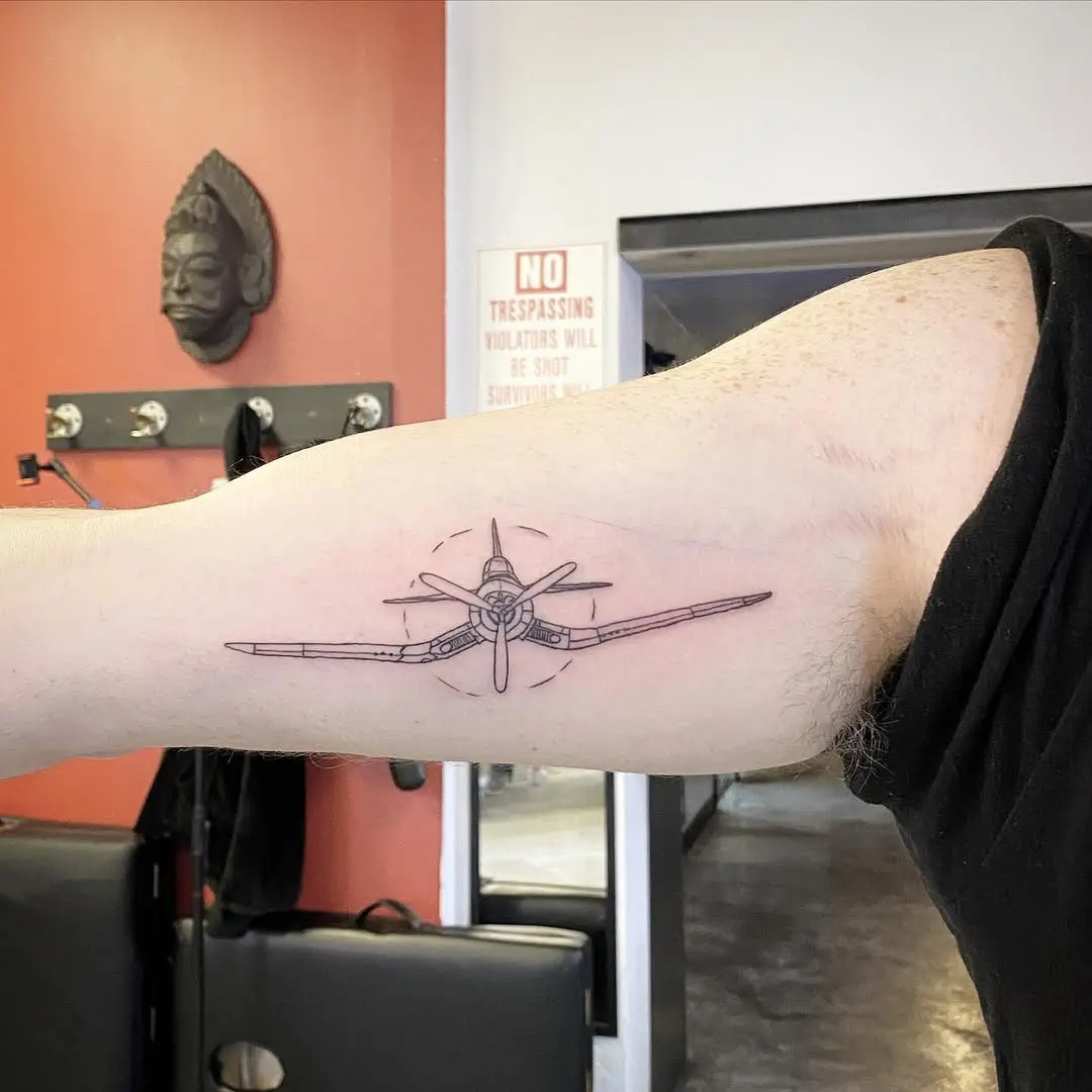 Elegant airplane tattoo showcasing vintage aesthetics