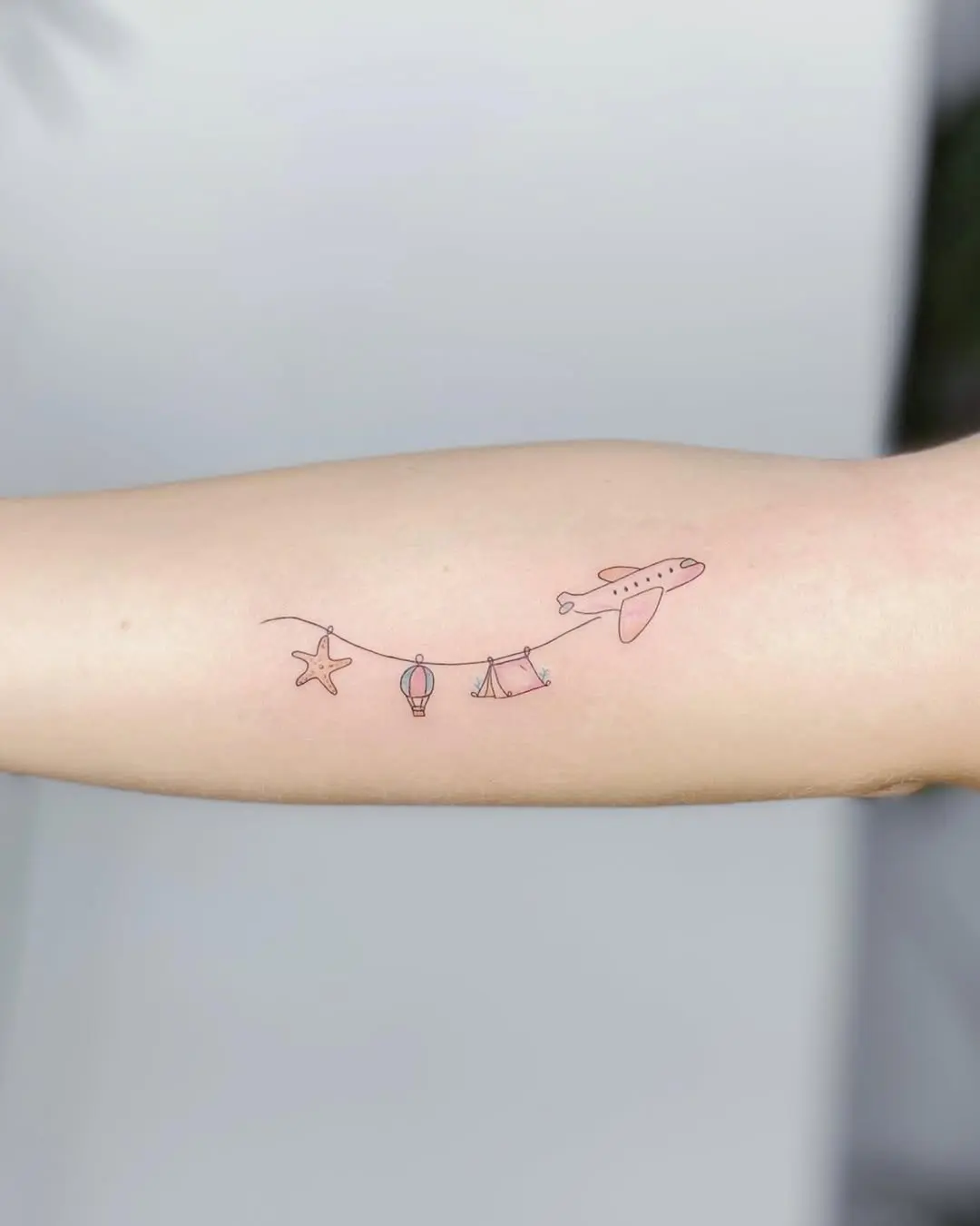 Charming airplane tattoo with nostalgic vibes