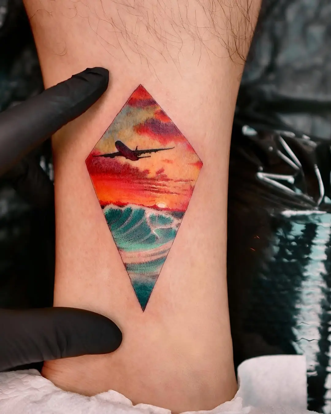 Stunning airplane tattoo with sunset vibes