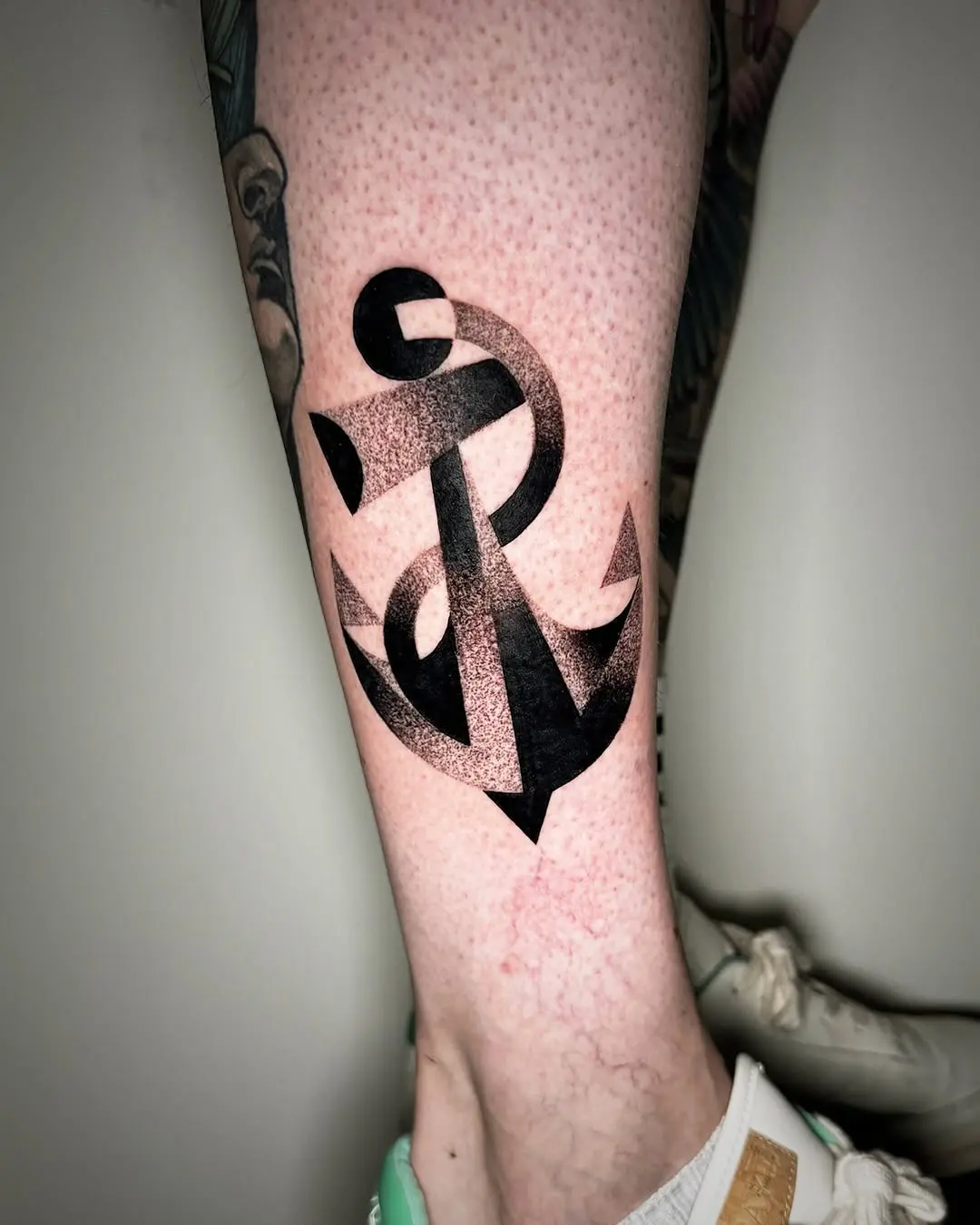 Stylish anchor tattoo in black and grey