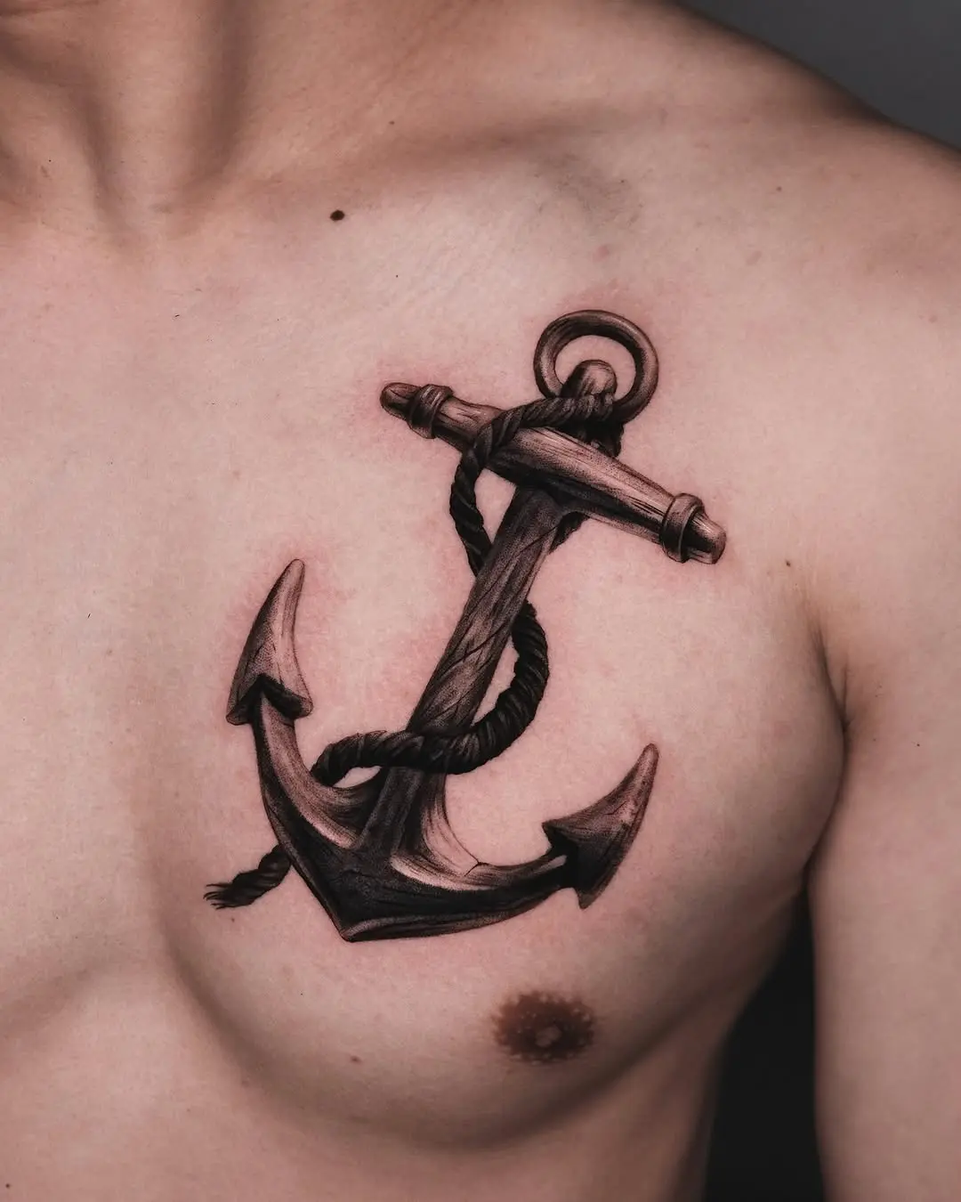 Realistic anchor tattoo on shoulder