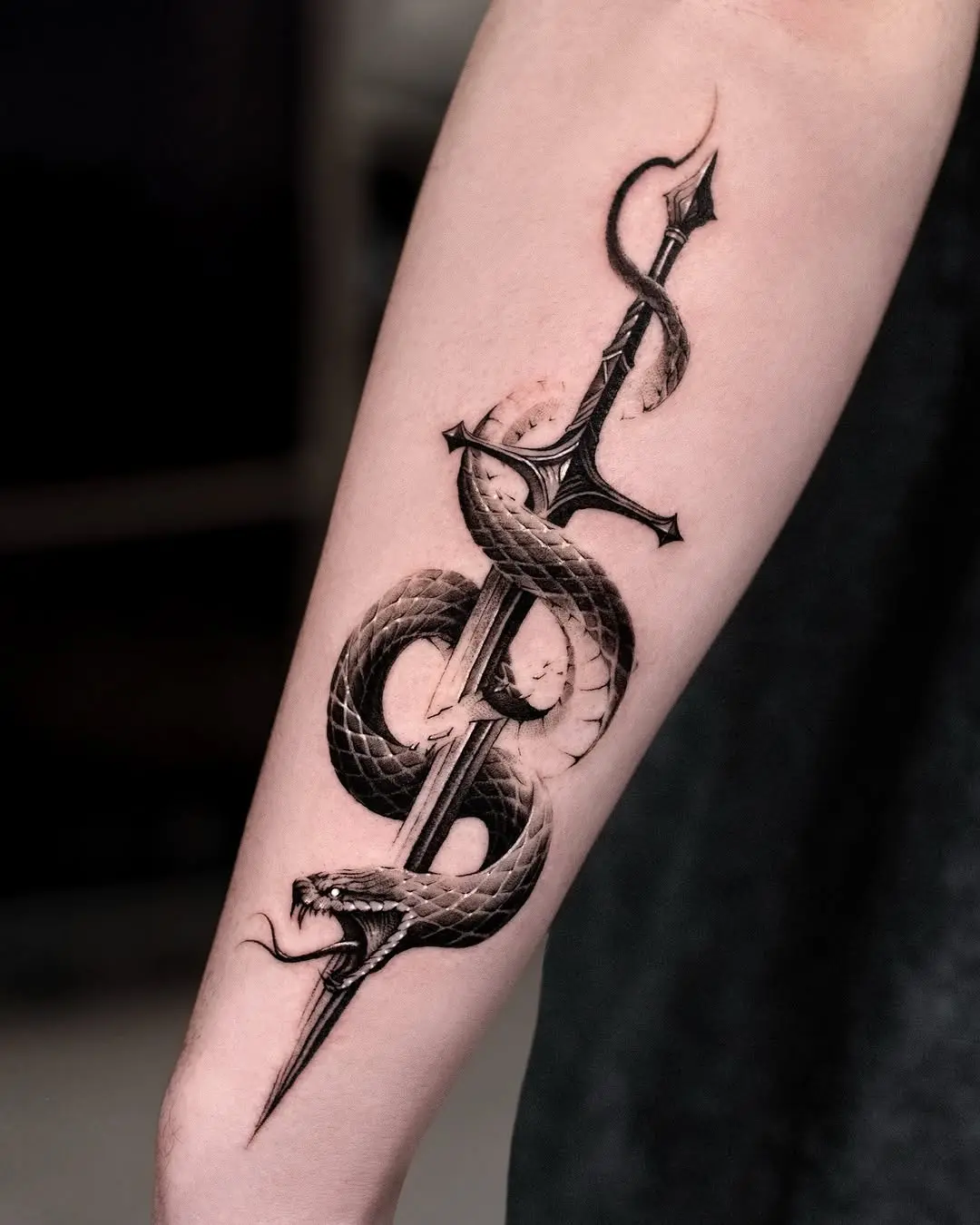 Elegant Snake Wrapped Around Sword Tattoo