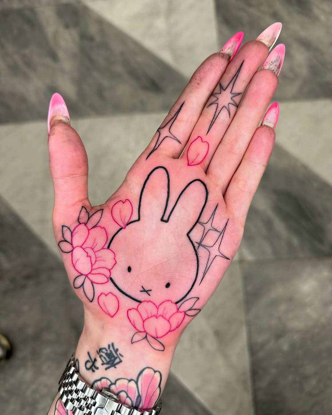 Cute bunny tattoo with floral details