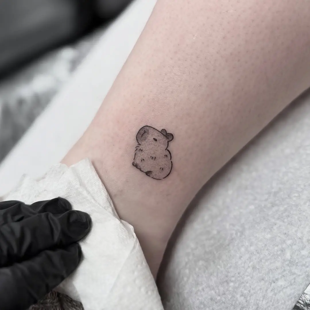 Charming small capybara tattoo design
