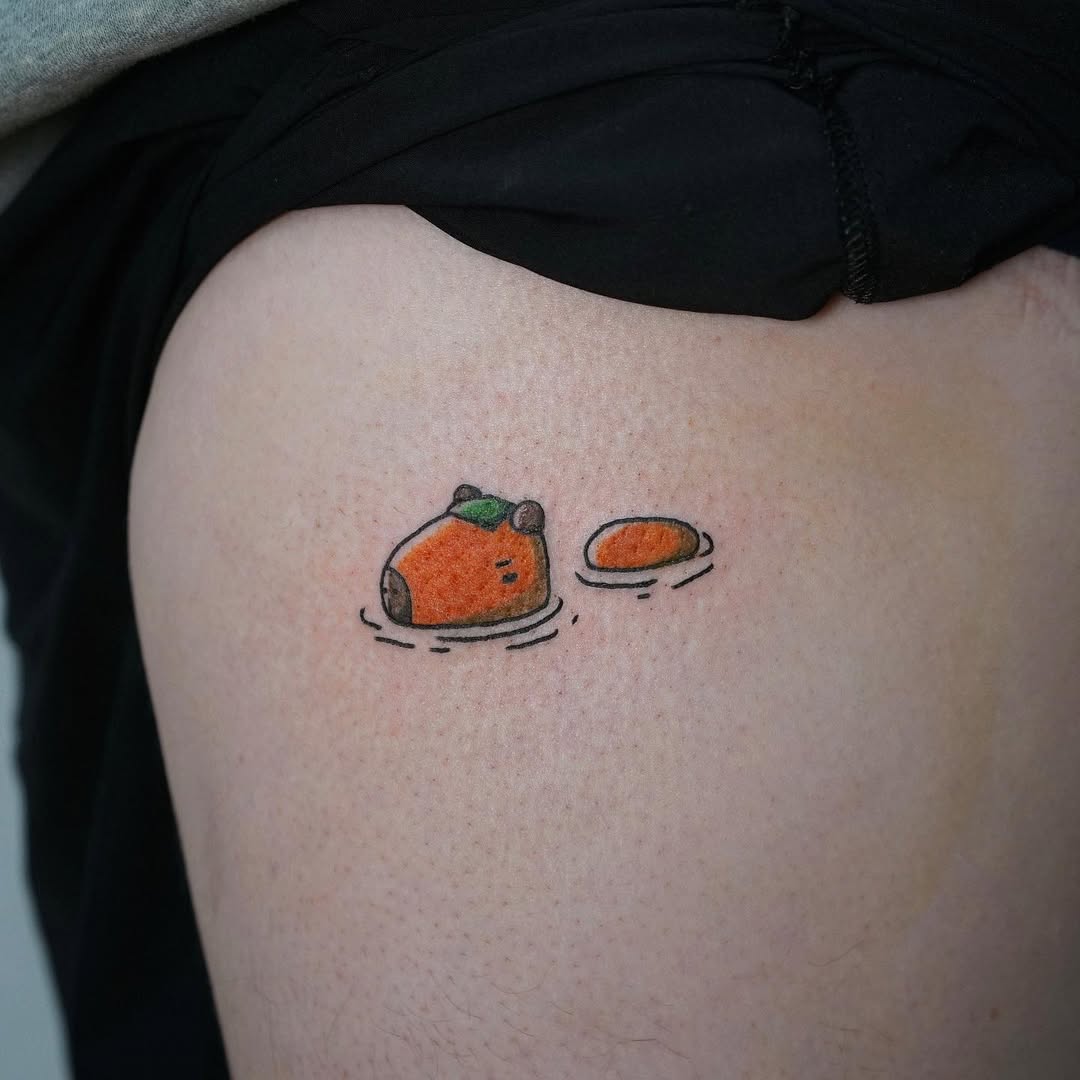 Whimsical capybara tattoo with playful elements