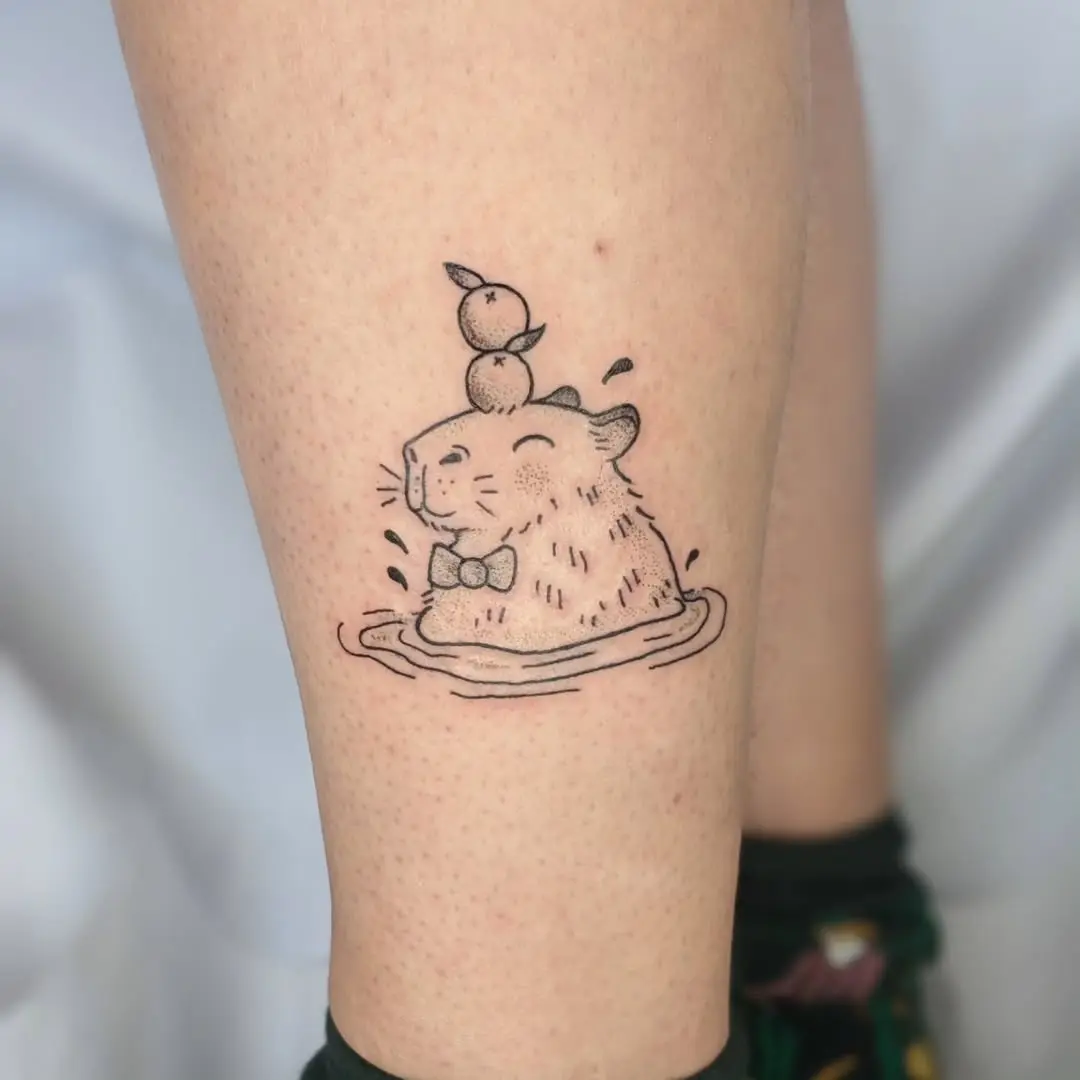 Playful Capybara Tattoo with Adorable Ducks