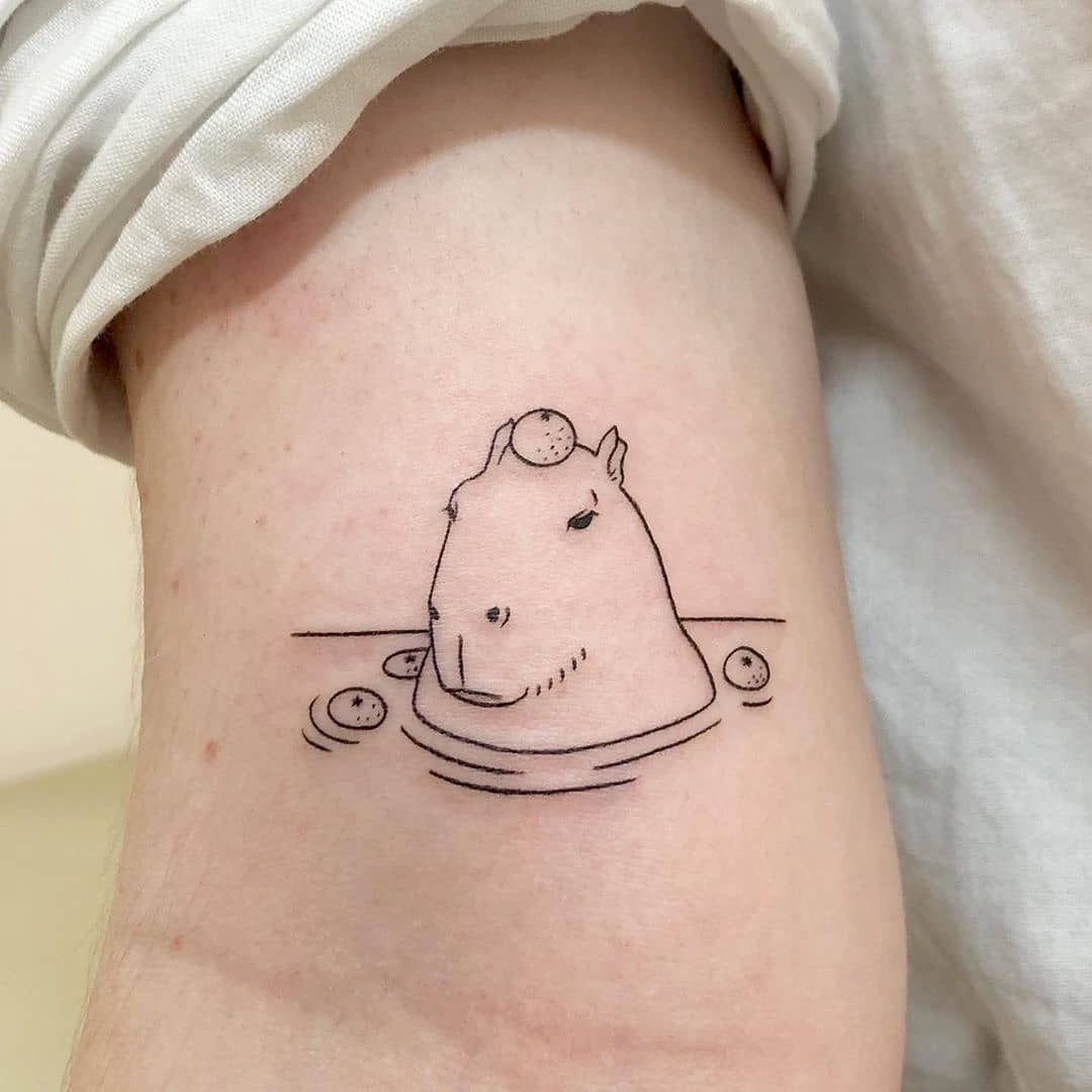 Charming capybara in a tranquil pool design