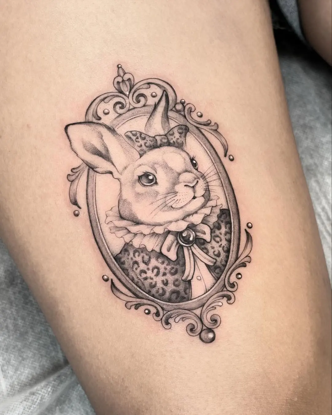 Charming bunny tattoo in ornate frame