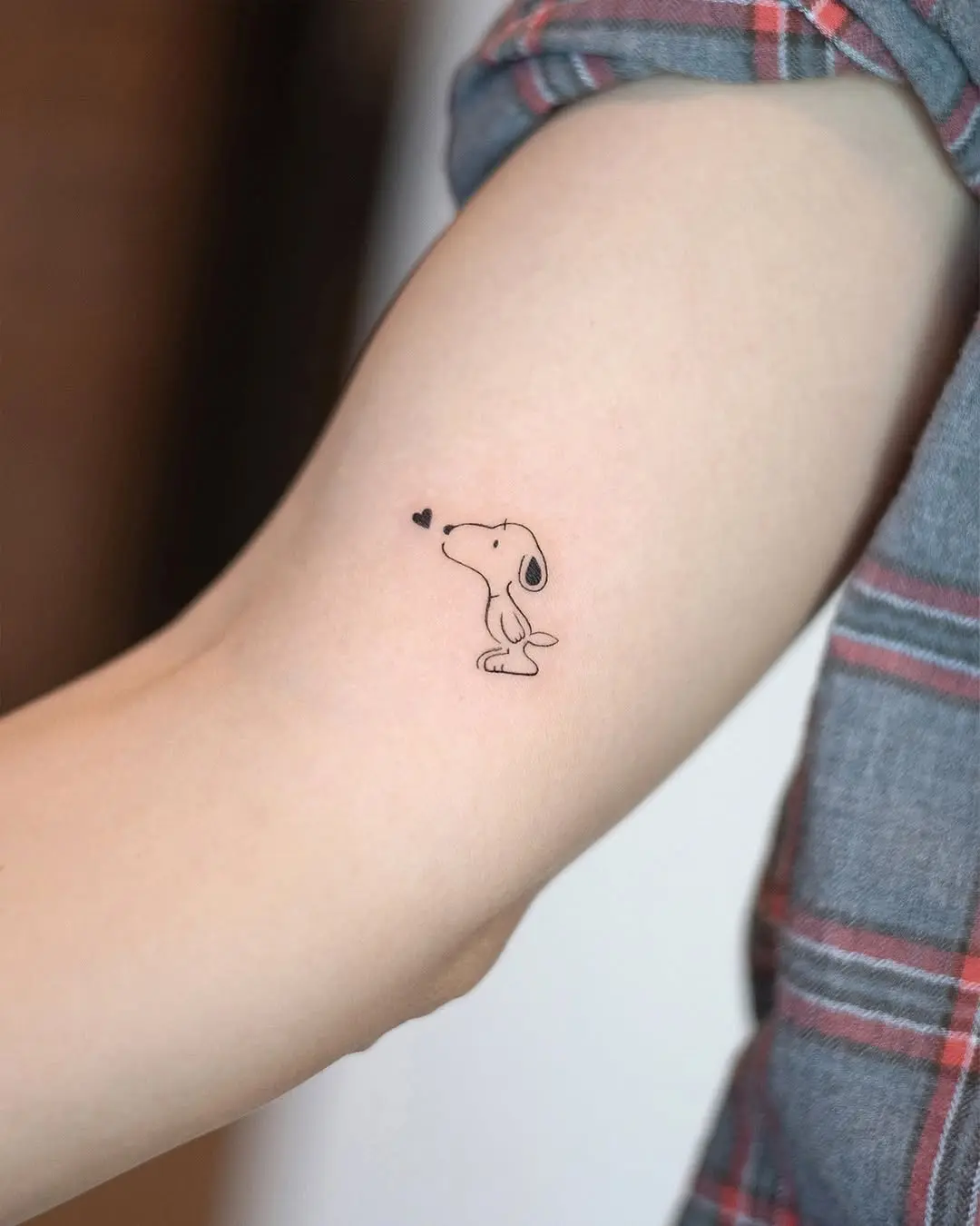 Adorable Snoopy Tattoo with Heart Detail