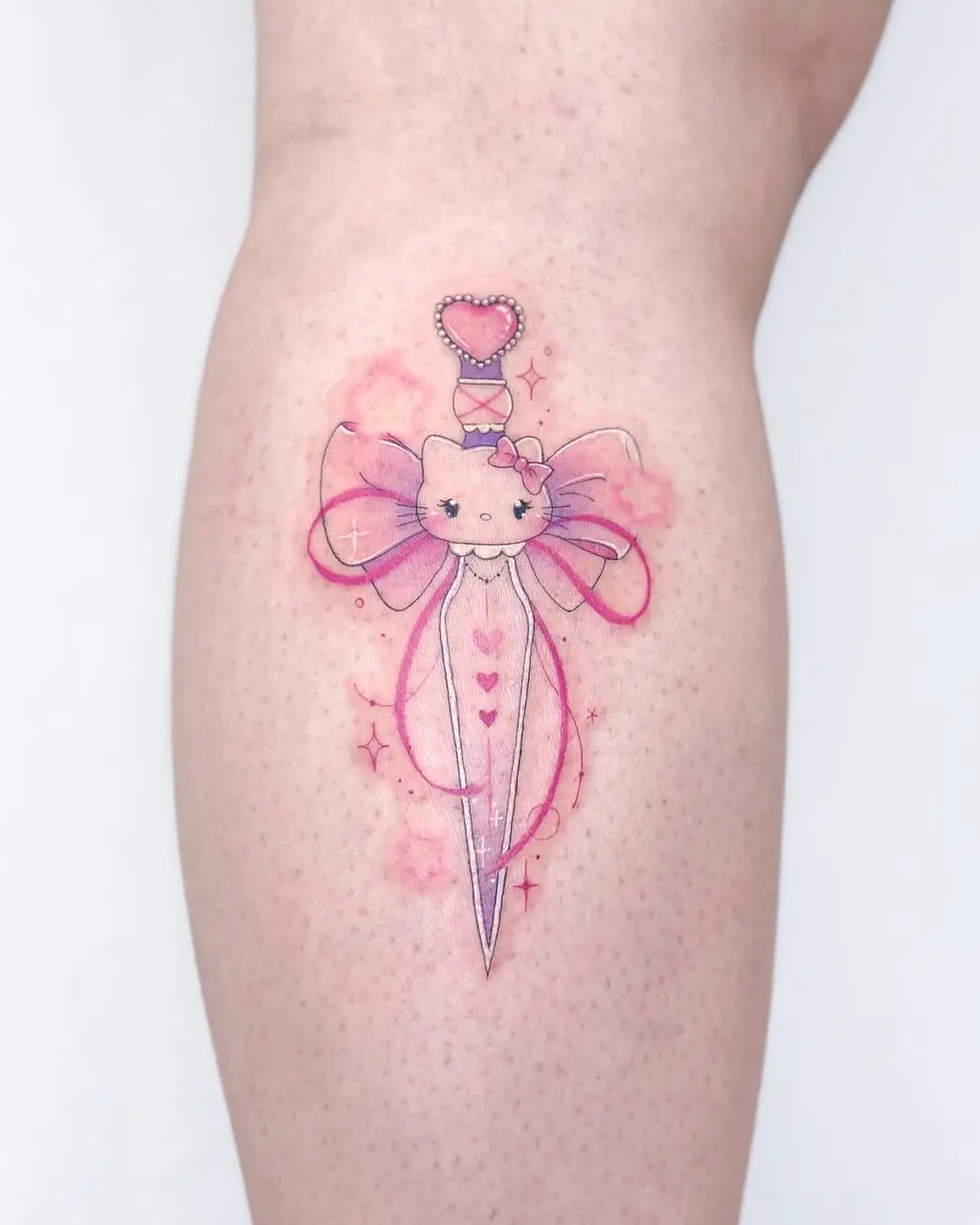 Charming fairy dagger tattoo with pink accents