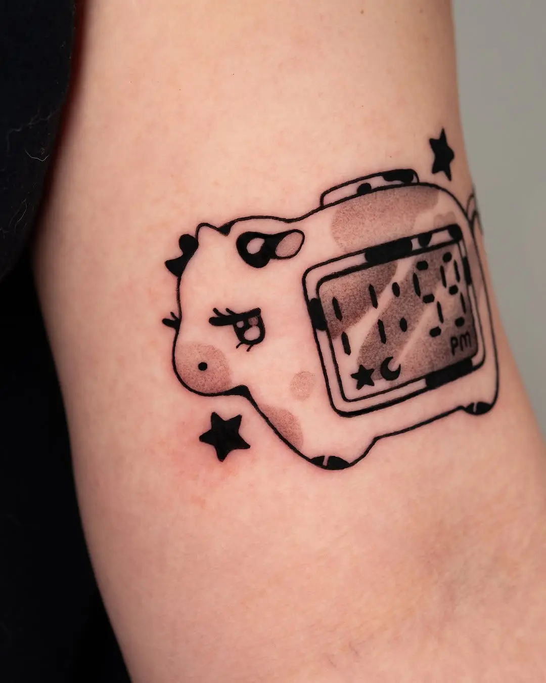 Whimsical Cow Tattoo with Camera Design