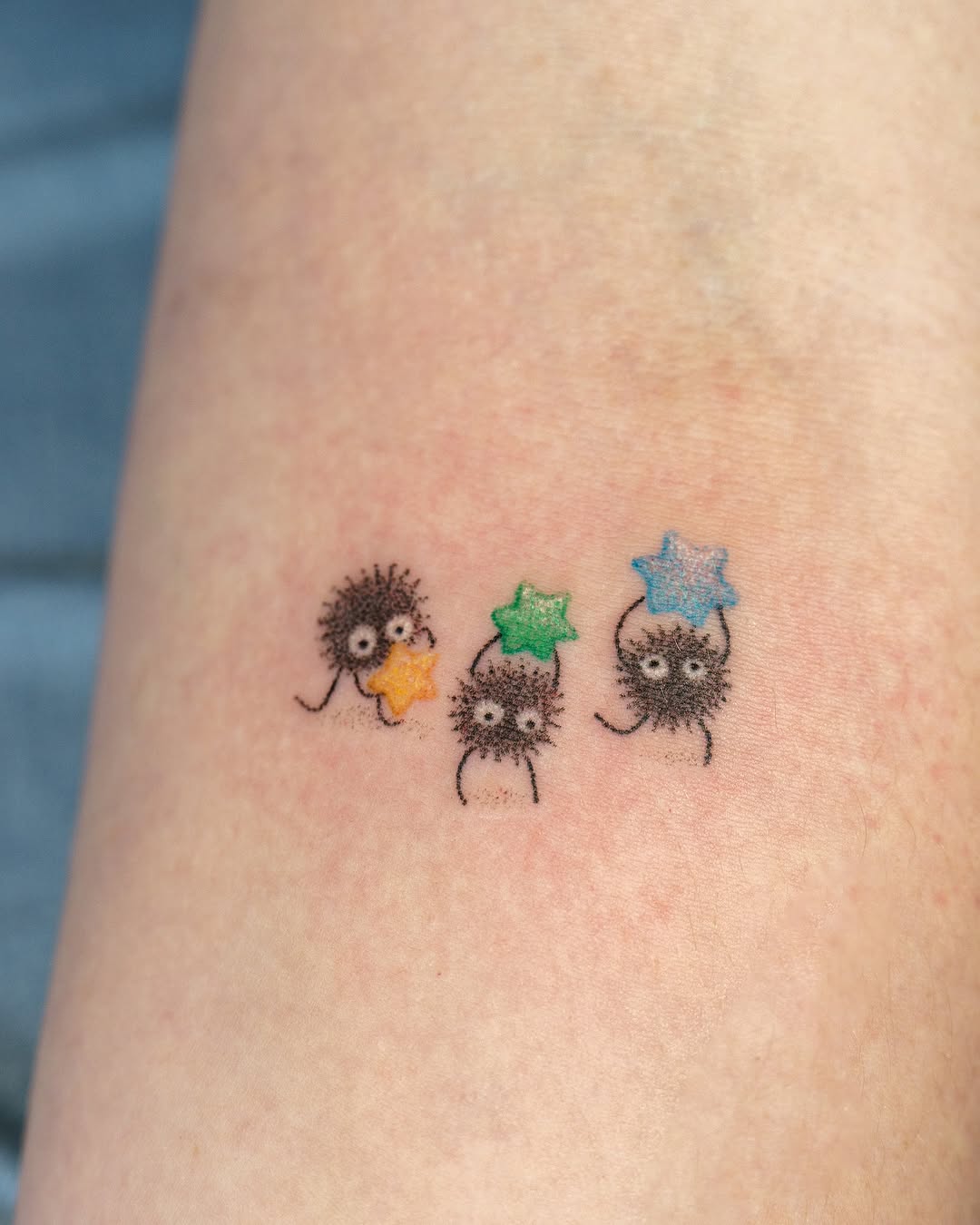 Whimsical tattoos of adorable cartoon characters.