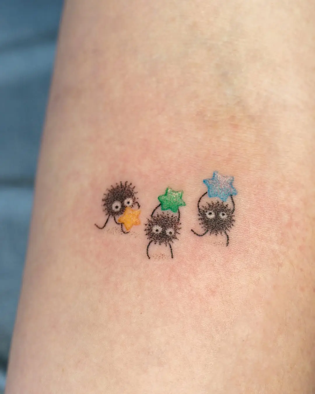 Whimsical tattoos of adorable cartoon characters.