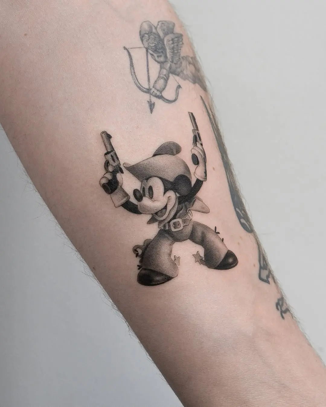 Mickey Mouse in a cowboy outfit tattoo design