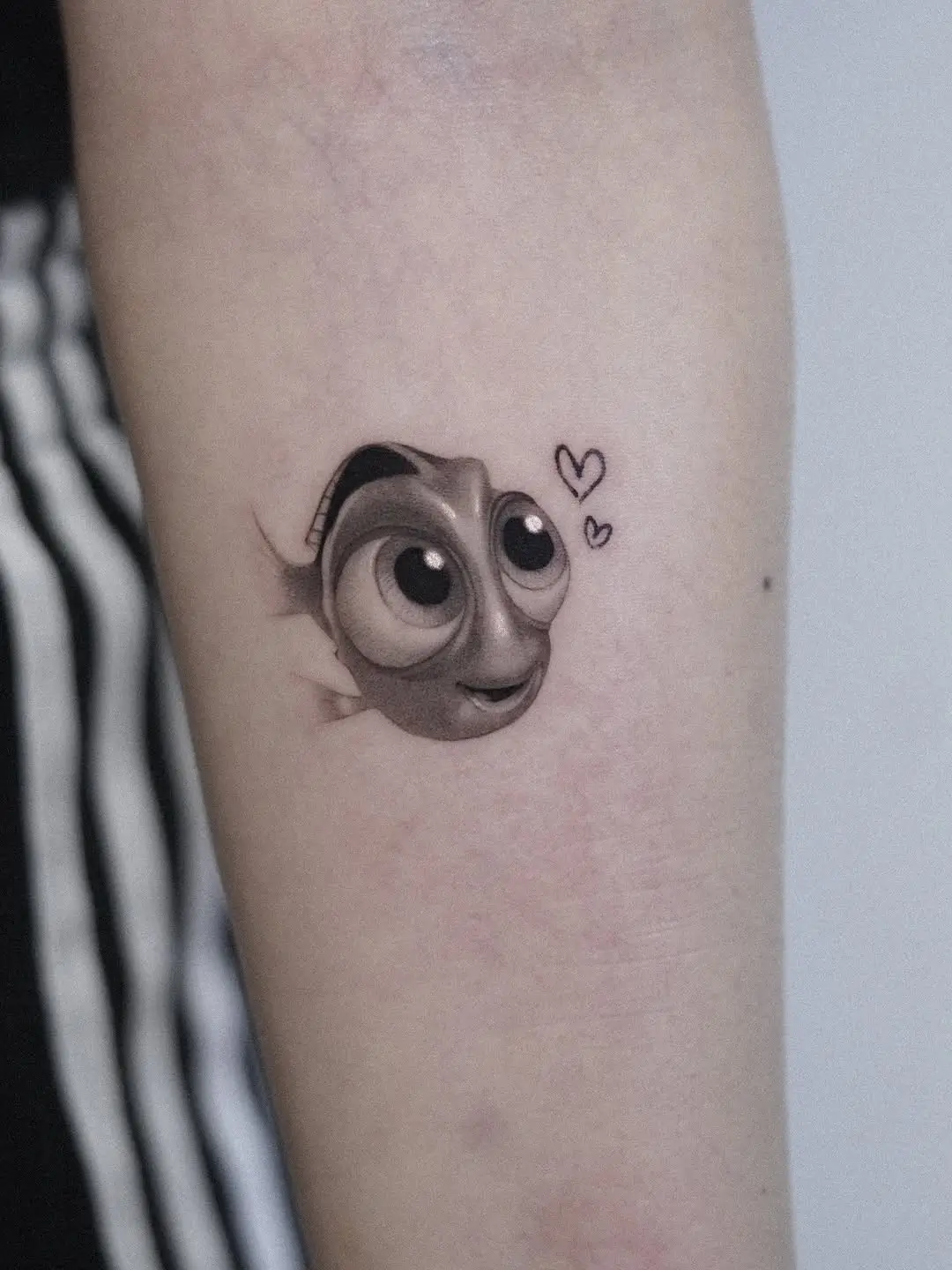 Adorable Dory tattoo with charming expression