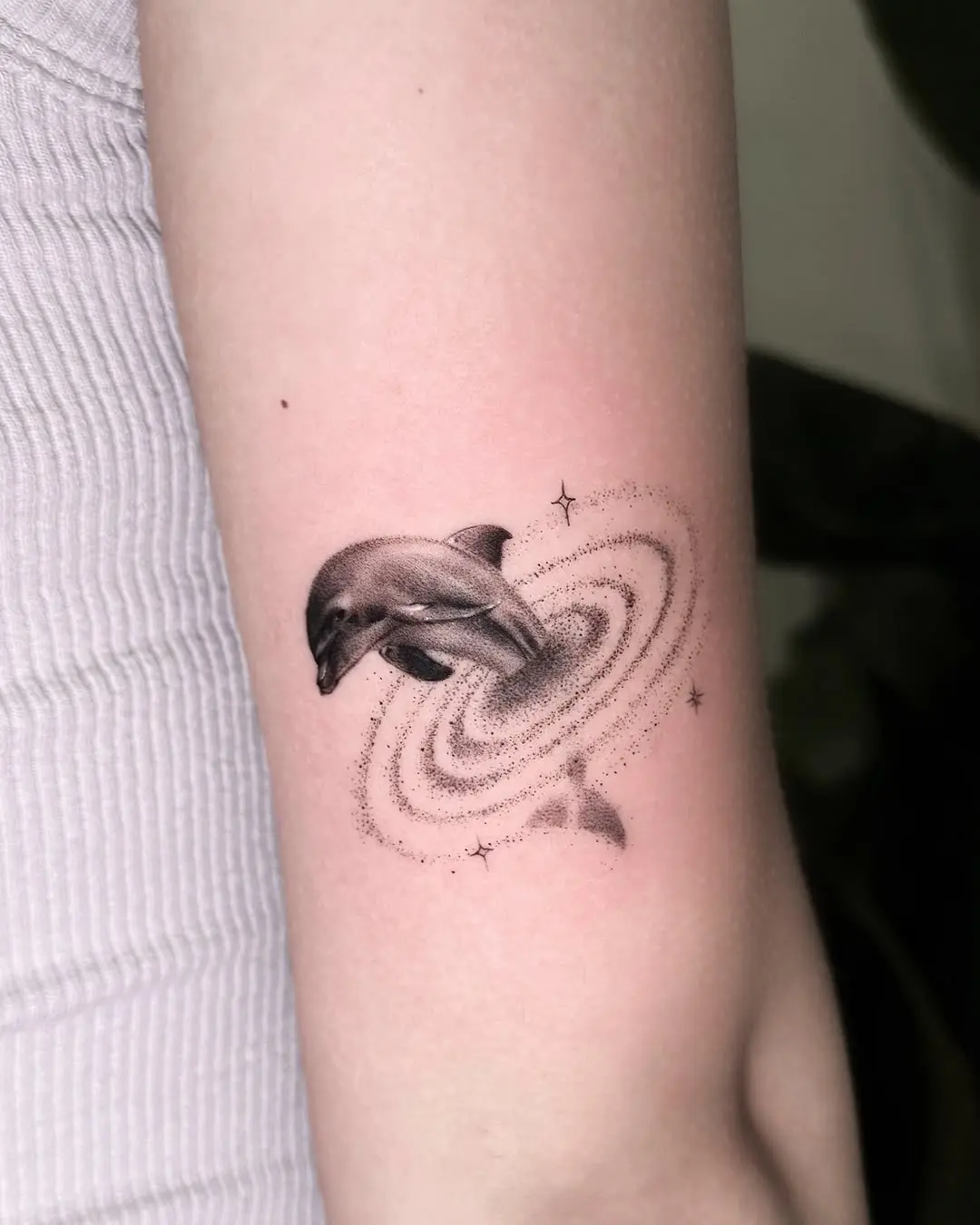 Stunning dolphin tattoo with galaxy vibes