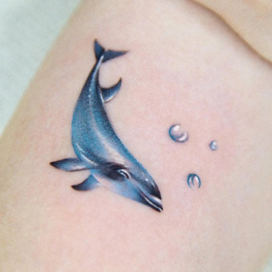 Realistic dolphin tattoo with bubbles