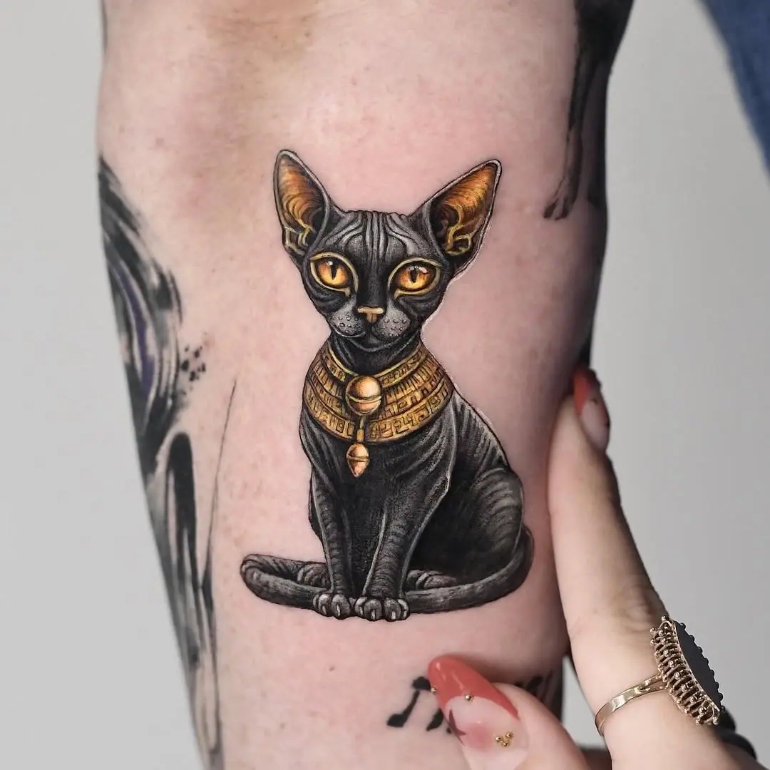 Majestic Egyptian Cat Tattoo with Golden Accents