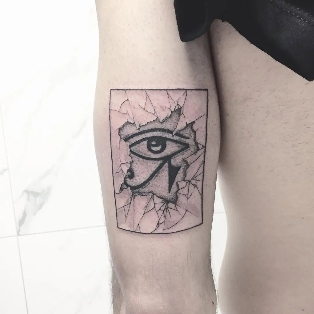 Intriguing cracked skin Egyptian eye tattoo