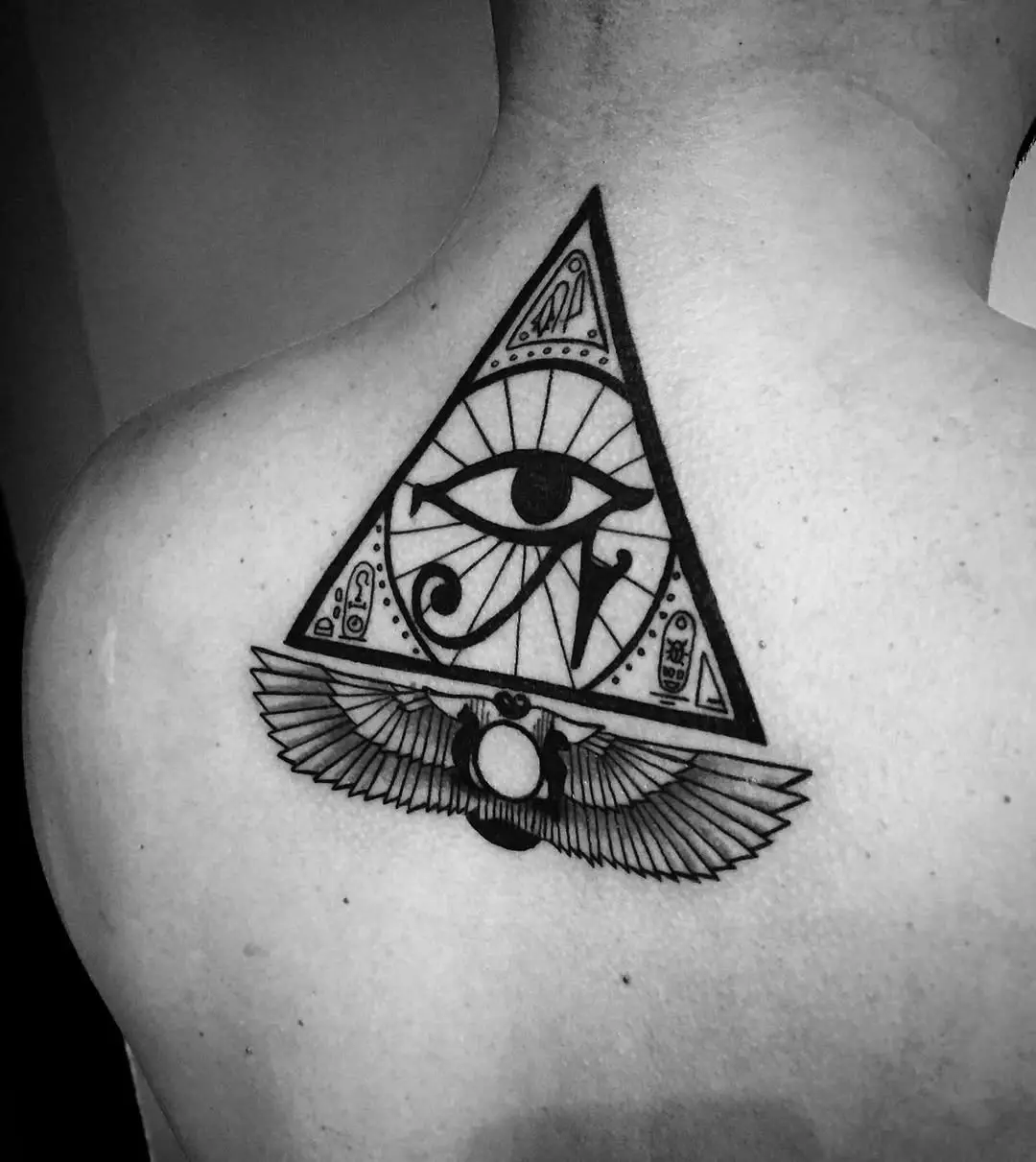 Symbolic Egyptian Eye Tattoo on Back