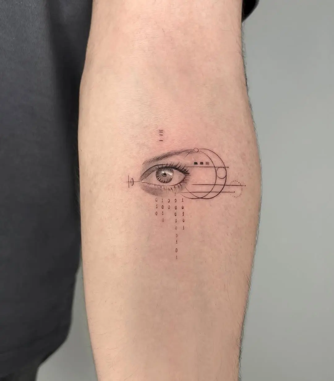 Intricate geometric eye tattoo on forearm