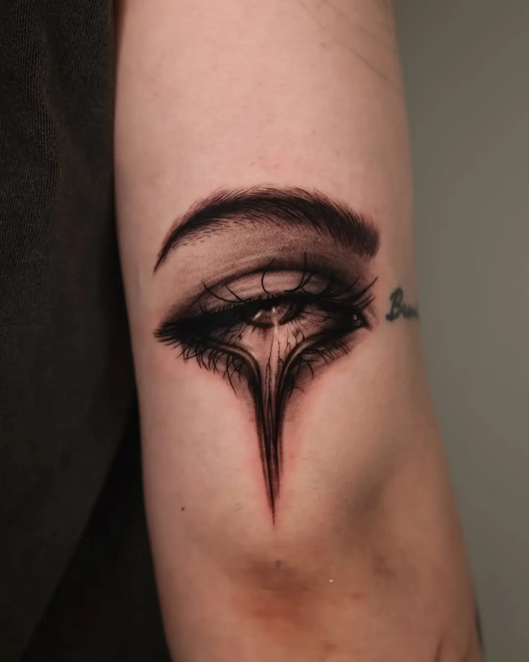 Realistic eye tattoo with deep shadows