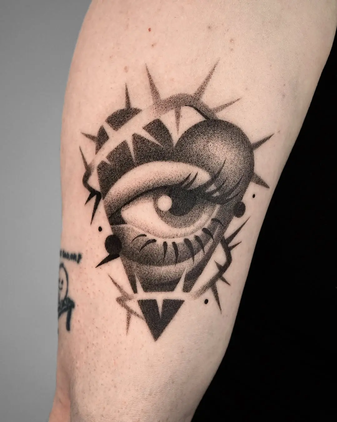Unique Eye Tattoo with Heart Symbolism