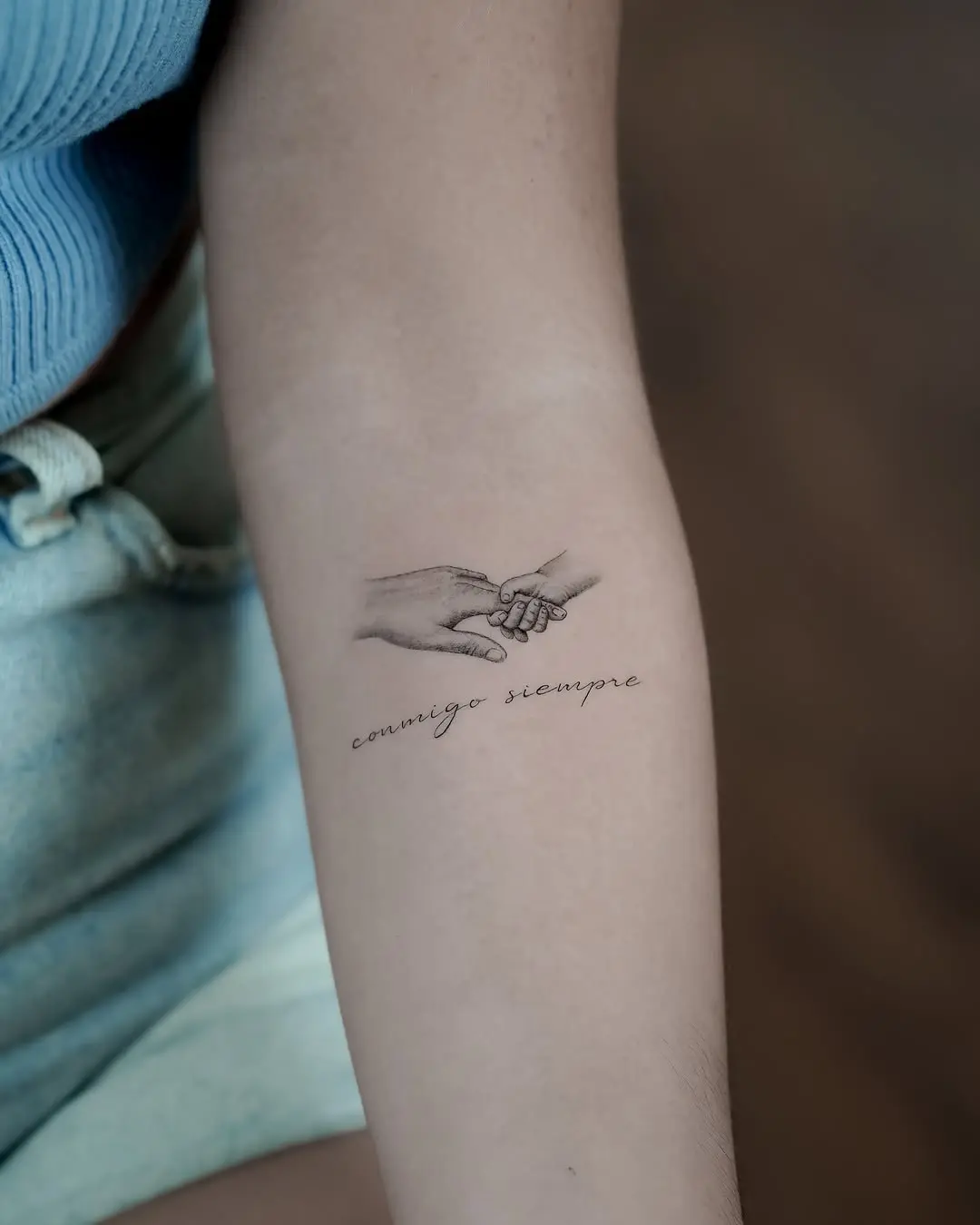 Symbolic bond between family members expressed.