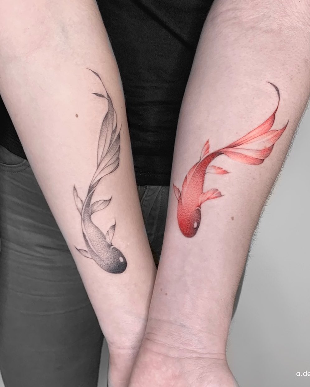 Symbolic fish tattoos for father and daughter