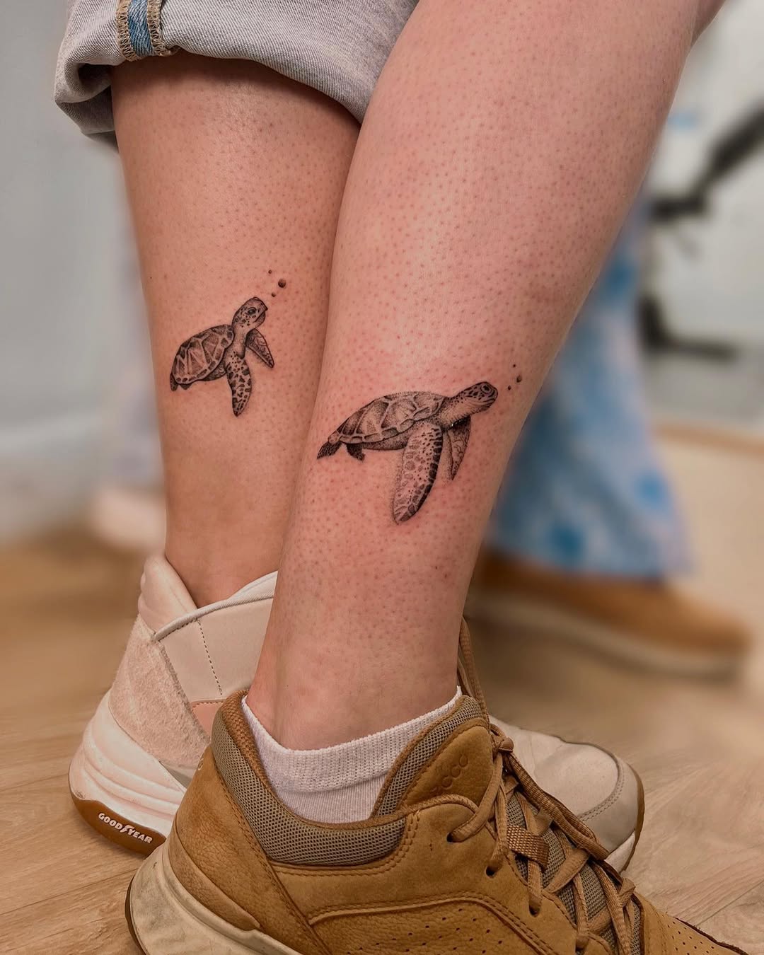 Symbolic turtle tattoos for father and daughter