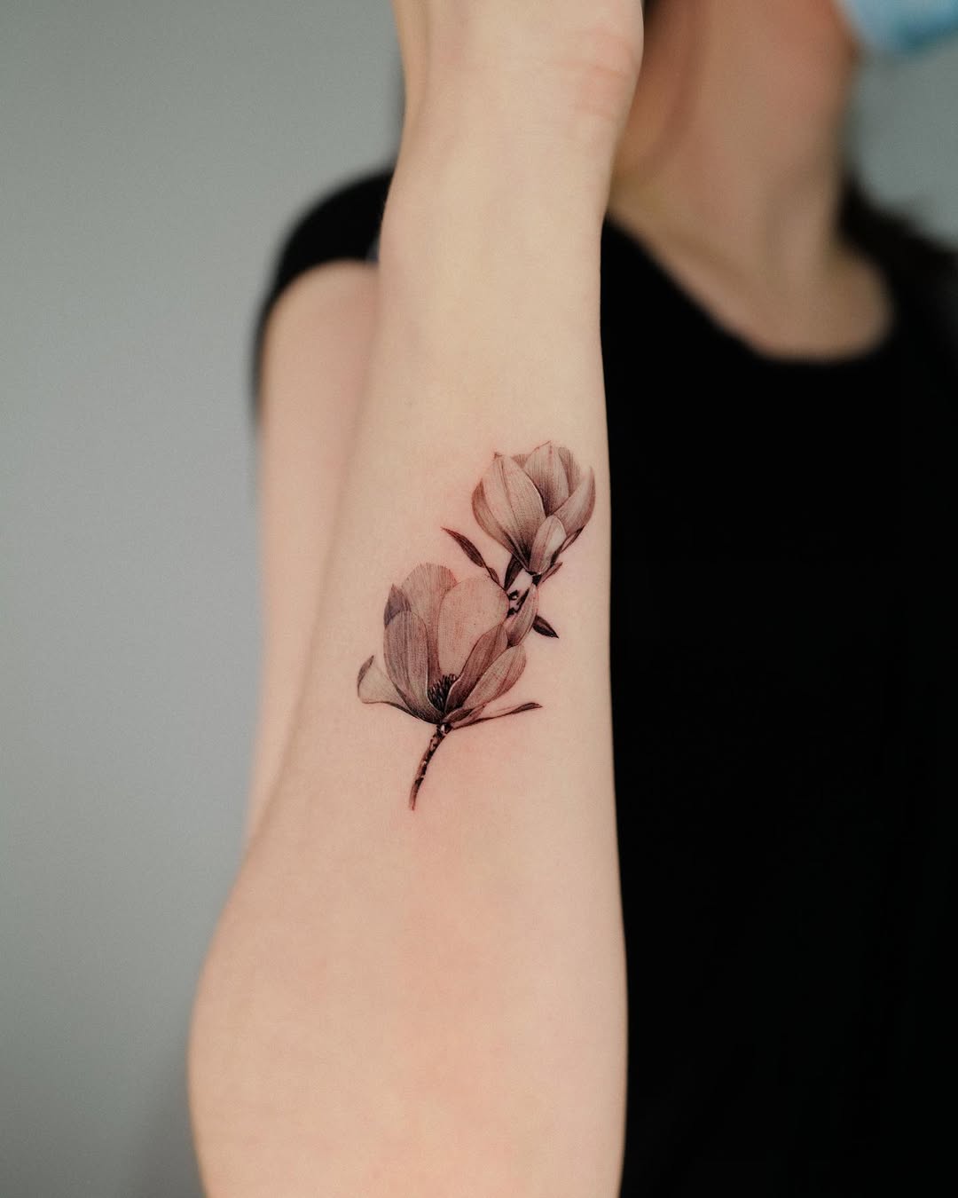 Delicate floral ink on a forearm