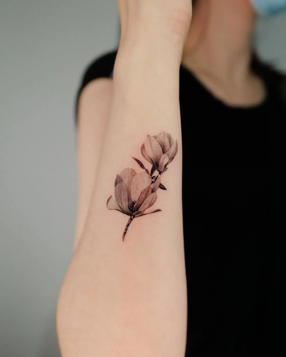 Delicate floral ink on a forearm