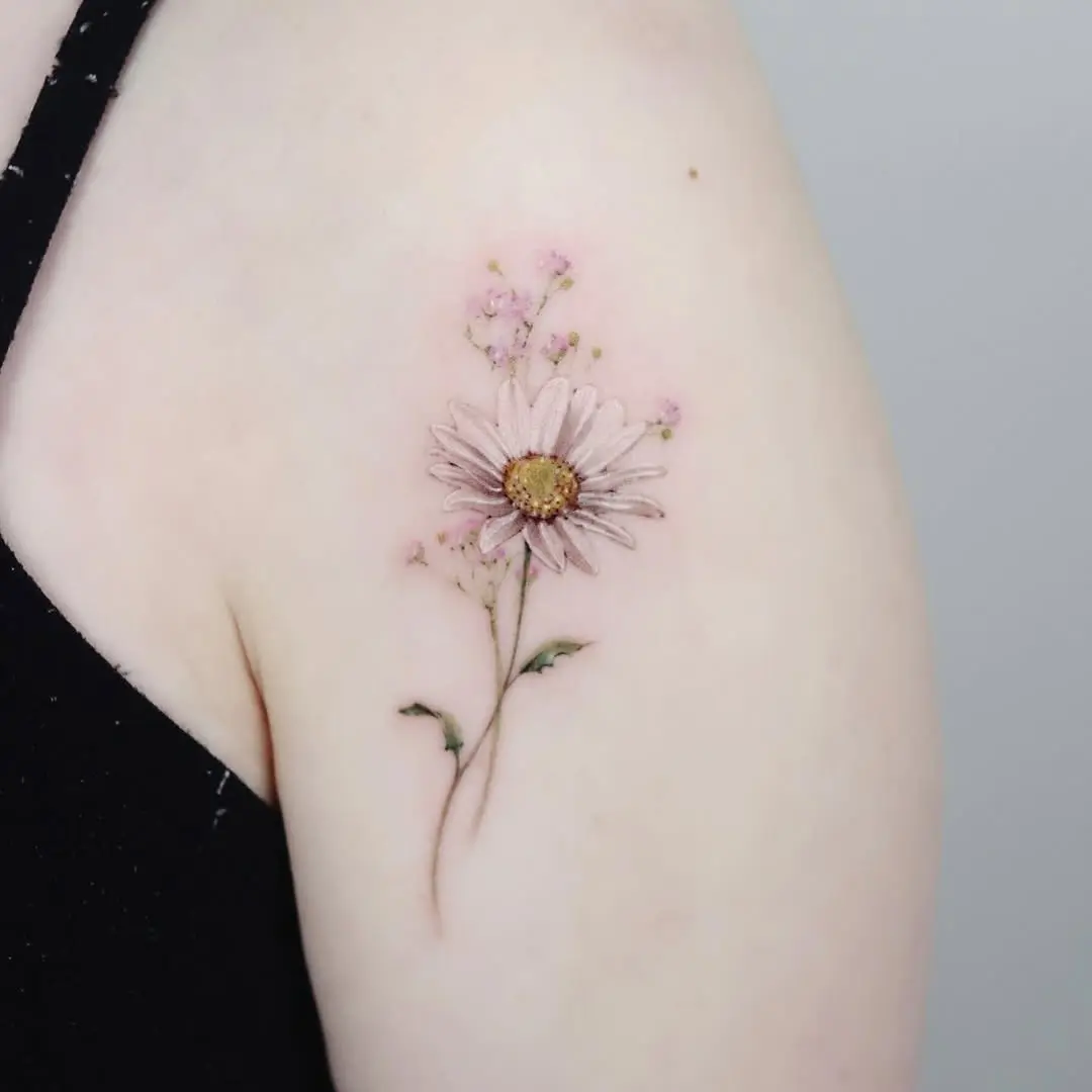 Delicate Pink Daisy Tattoo with Subtle Accents