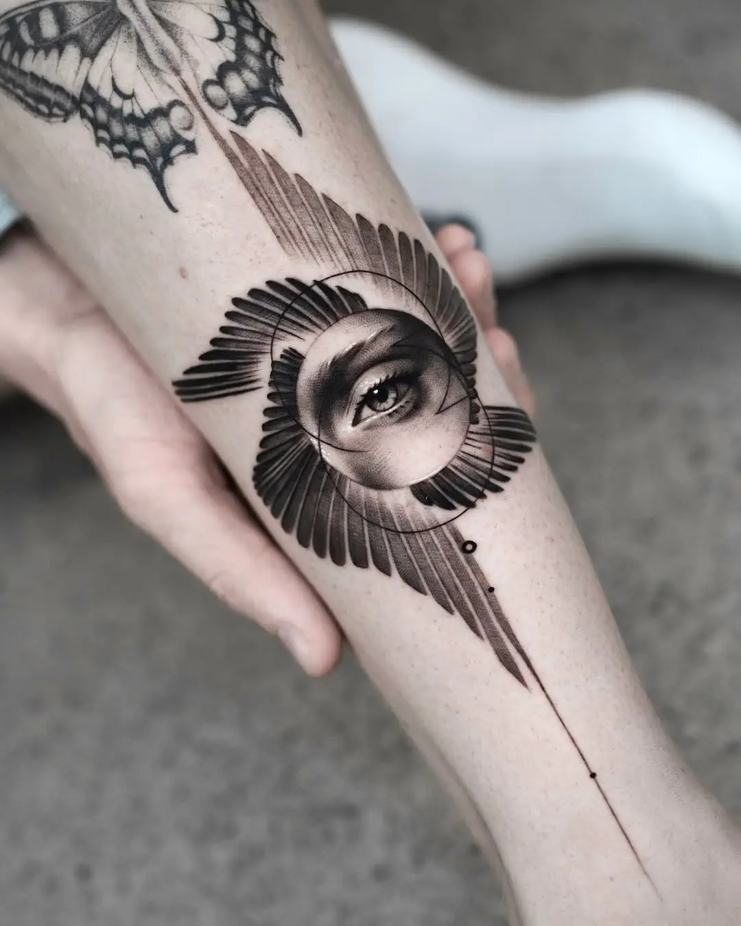 Intricate Eye Tattoo with Feather Design