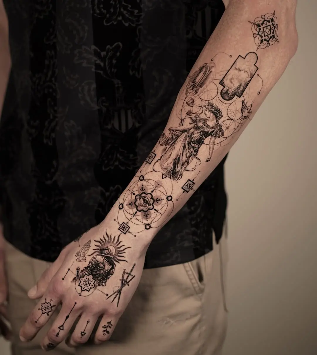 Intricate black ink forearm tattoo designs